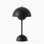 Minimalist rechargeable table lamp with dimmable LED light and cordless design