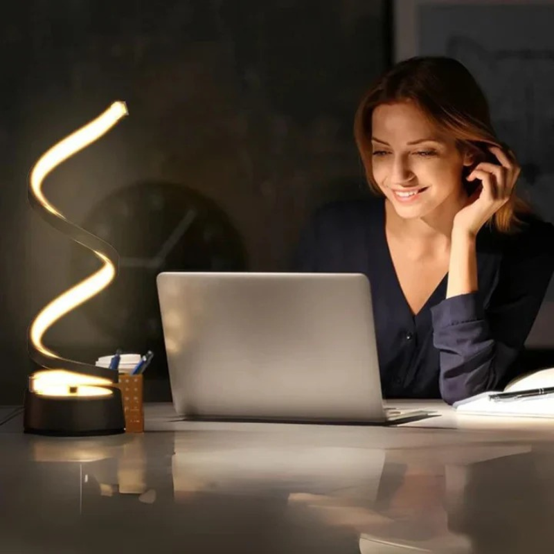 Modern spiral LED table lamp with dimmable light and touch control in a sleek twisted design