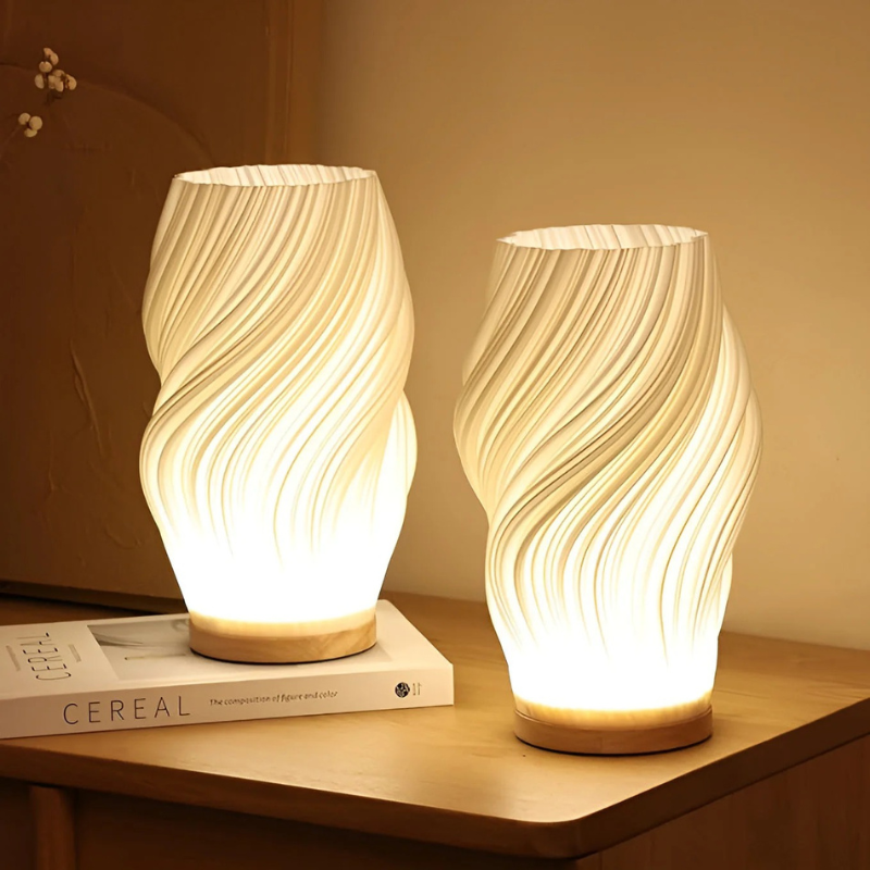Compact sculptural LED swirl lamp with warm dimmable glow and USB power