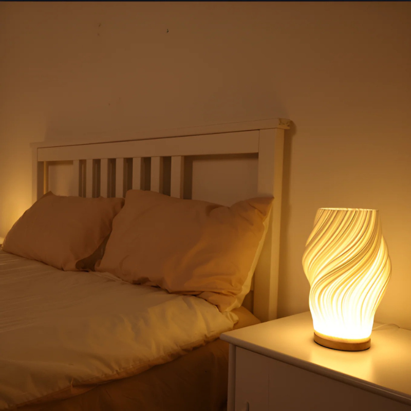 Compact sculptural LED swirl lamp with warm dimmable glow and USB power