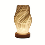 Compact sculptural LED swirl lamp with warm dimmable glow and USB power