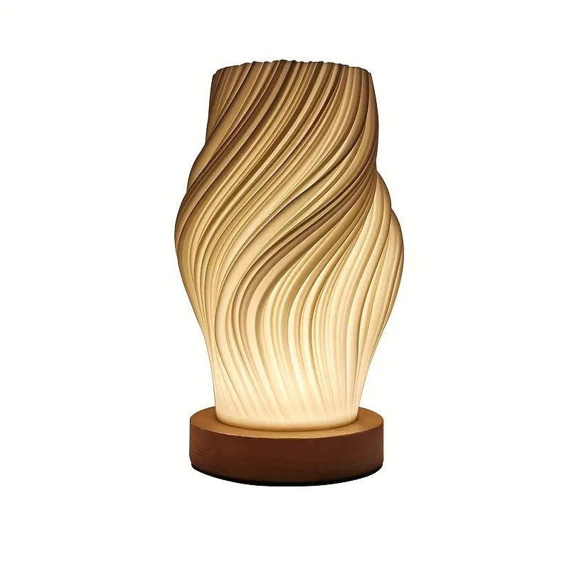 Compact sculptural LED swirl lamp with warm dimmable glow and USB power
