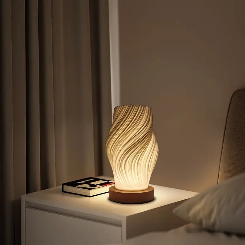 Compact sculptural LED swirl lamp with warm dimmable glow and USB power