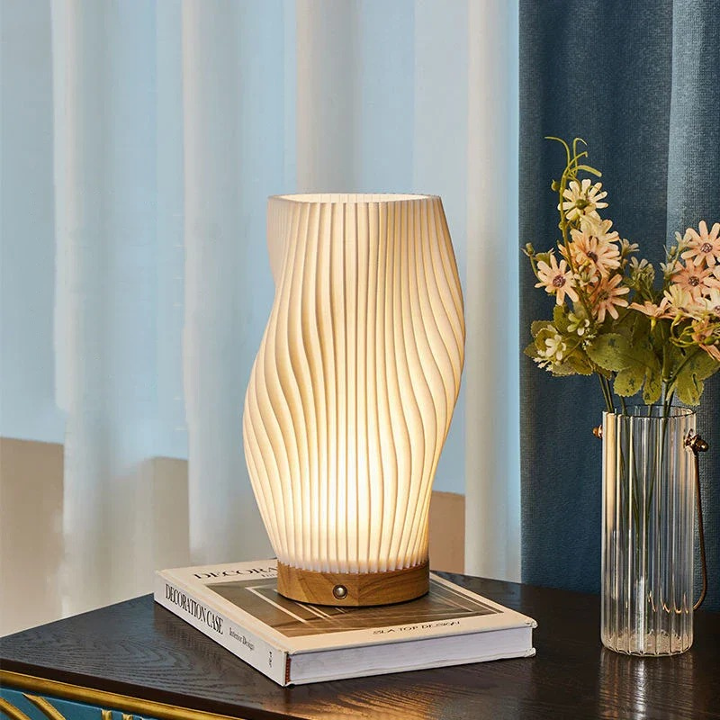 Compact sculptural LED swirl lamp with warm dimmable glow and USB power
