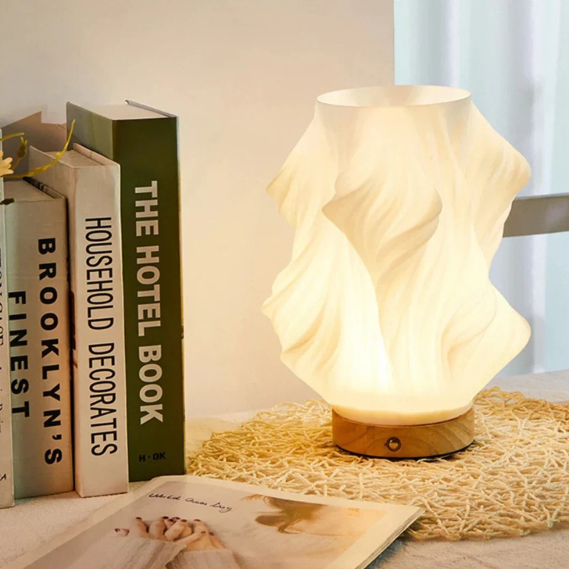 Compact sculptural LED swirl lamp with warm dimmable glow and USB power