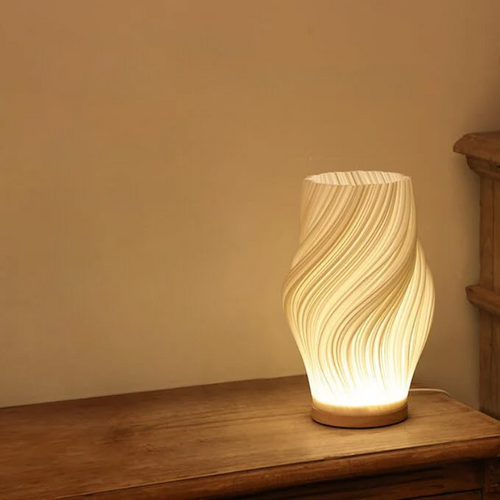 Compact sculptural LED swirl lamp with warm dimmable glow and USB power
