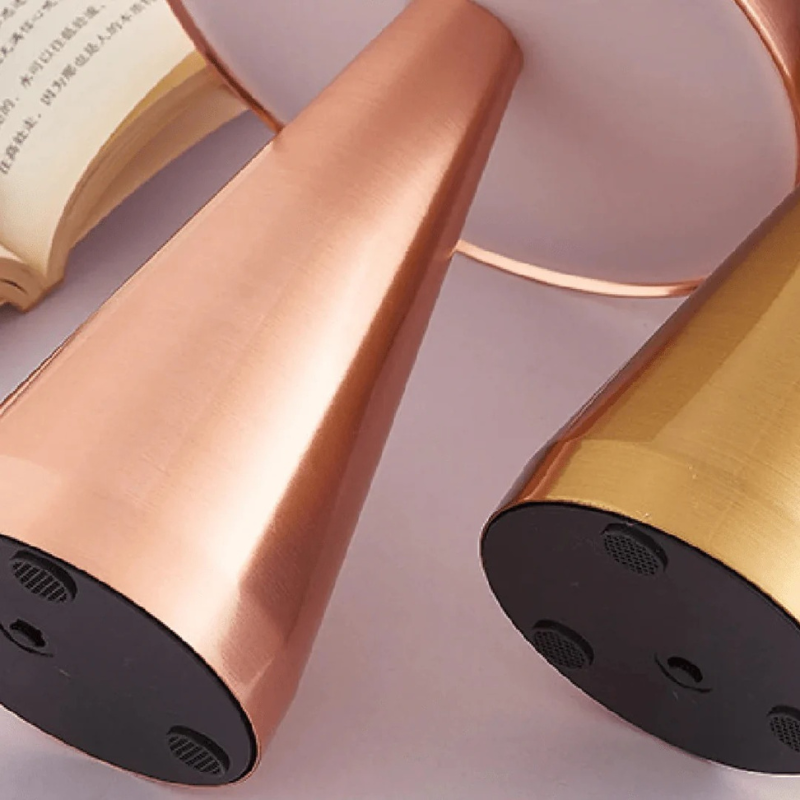 Compact wireless mini LED table lamp with touch control and minimalist Danish design